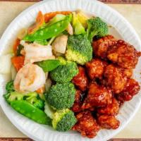 Dragon & Phoenix · Spicy. Hot one side with general tso's chicken, the other with shrimp mixed vegetables.
