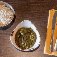 Palak Paneer · Spinach cooked with home made cheese and mild spices.