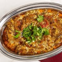 Baingan Bharta · Eggplant roasted, mashed and sauteed with tomatoes, onions and spices.