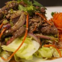 Tiger Tear · Tender sliced and grilled beef with lime juice, fish sauce, cilantro, red onions, scallions,...