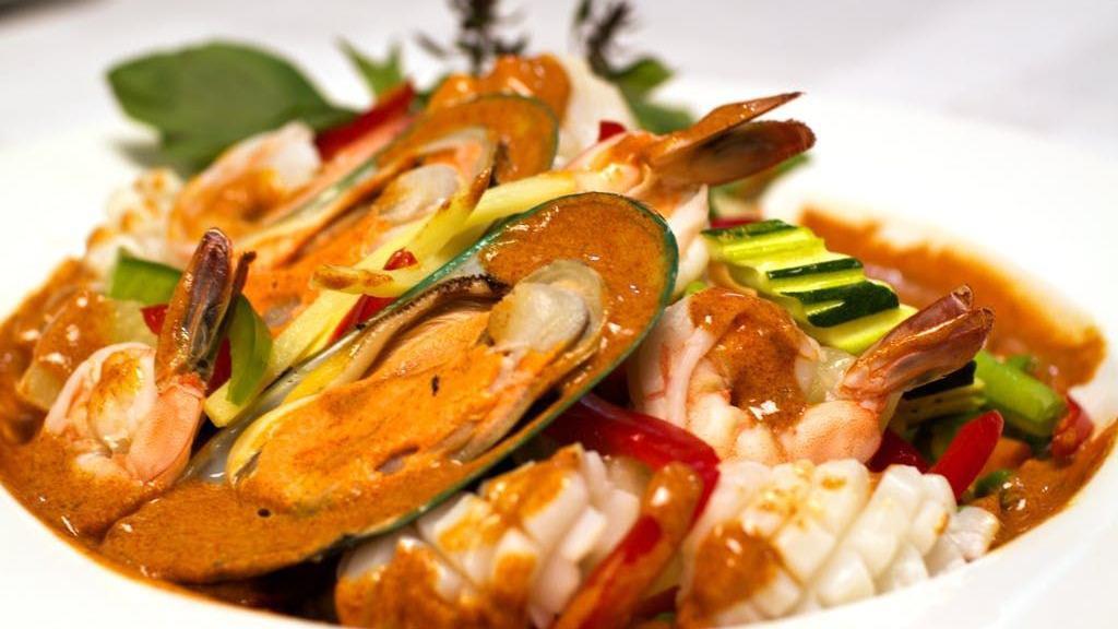 Seafood Tornado · A mixture of shrimp, scallops, calamari, mussels, and fish with sweet chili garlic sauce and fresh basil and served with steamed mixed vegetables.
