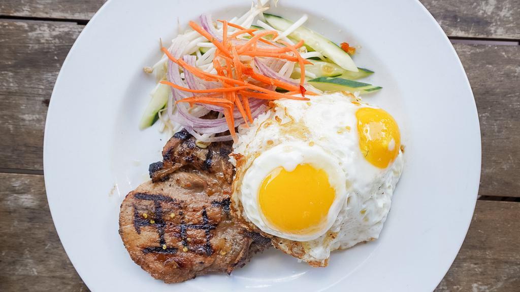 Grilled Pork Chop No 5 & Eggs · Grilled house marinated center cut pork chop, fried eggs, pickled veggies, white rice.