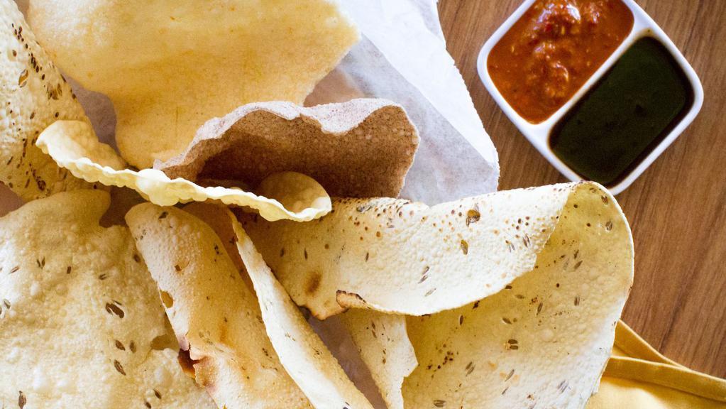 Papadum · Lentil wafer fried and roasted, served with mint and tamarid