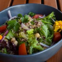 Quinoa Salad · Vegan. Gluten free. Mixed greens, quinoa, chickpea, cucumber, tomato, onion, citrus dressing.