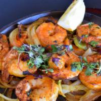 Shrimp Tikka · Marinated in yogurt, ginger, garlic, tandoori spices, and served over onions and peppers
