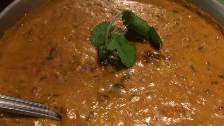 Dal Makhani (Creamy Lentils) · Gluten free. Red and black beans, black chana, urda dal, chana dal, onion, tomato, cream, spices.