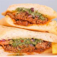The Chimichurri · Tender marinated steak or chicken topped with grilled red onions, tomato slices, and fresh v...
