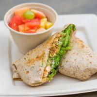 Merengue Wrap · Marinated chicken breast, bacon, avocado, mixed greens and sour cream wrapped in a whole whe...