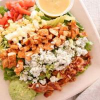 Cuban Cobb Salad · Grilled chicken breast, bacon, hard boiled egg, blue cheese, avocado and tomatoes served ove...