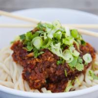 Spicy Garlic Peanut Noodles · Wok-toasted peanuts & garlic, our house chili oil, & hints of sesame & soy. Served warm over...