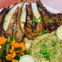 Grilled Cordero (Lamb) · Four lamb chops marinated and chargrilled. Served with two sides.