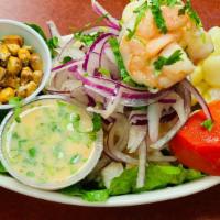 Ceviche De Pescado · Fresh fish marinated in lime juice, mixed with special spices. Served with sweet potato and ...