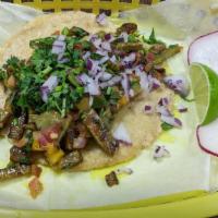 Tacos · Handmade corn tortilla, onions, cilantro.