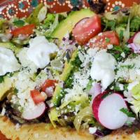 Huaraches · Huge thick corn base, fried, topped with beans, lettuce, sour cream, queso fresco, avocado, ...