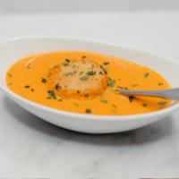 Exp Cup Tomato Soup · Creamy house-made tomato soup with cheese fritter.