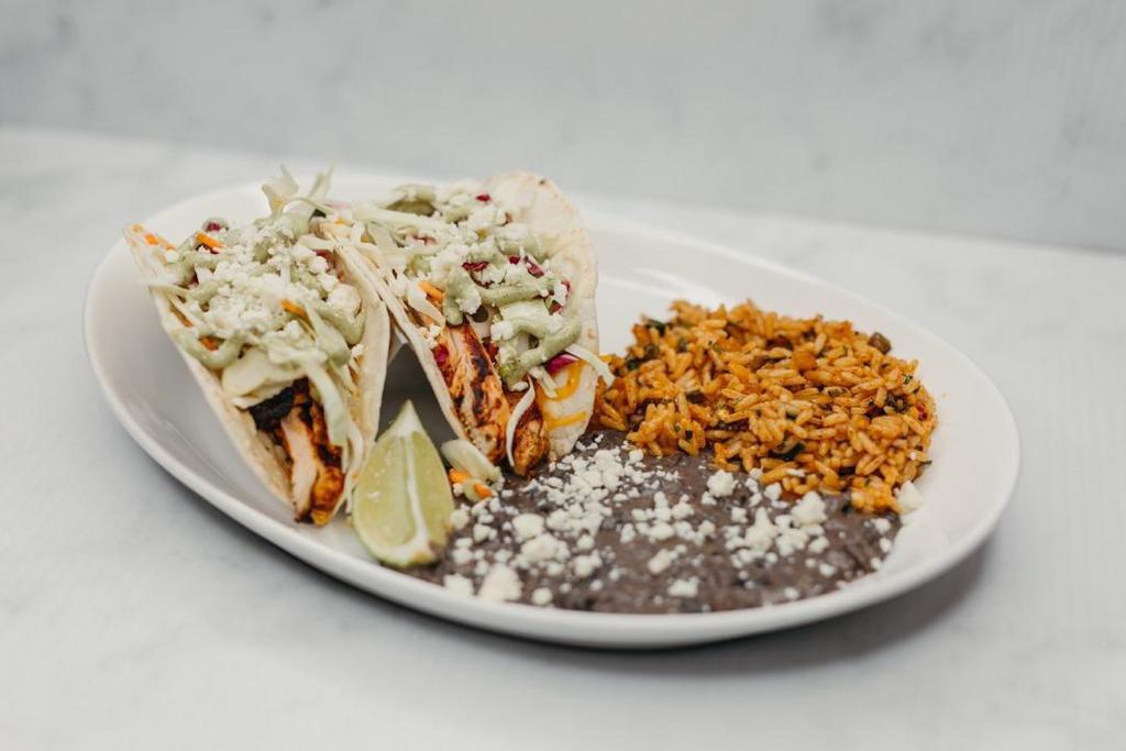 Exp Chipotle Chicken Tacos · Woodfired chipotle chicken, baja slaw, pepper jack cheese, avocado-jalapeño aioli, cotija