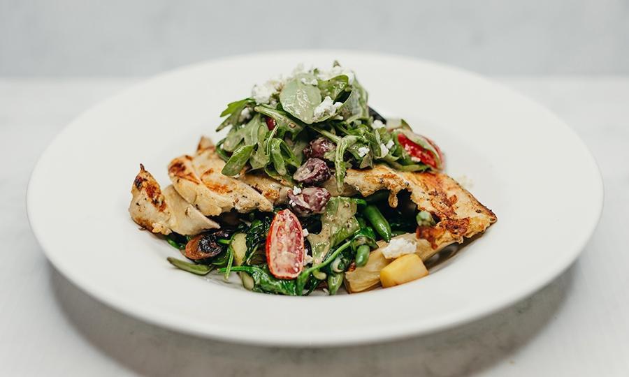 Exp Julie'S Light And Fit · Woodfire grilled chicken breast, mushrooms seasonal veggies, artichokes,. Kalamata olives, green beans, topped with goat cheese and tomato salad