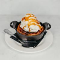 Exp Skillet Bourbon Pecan Pie · A Red Door original. Vanilla bean ice cream, caramel sauce