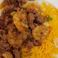 Shrimp And Grits · Homestyle Grits with Grilled Shrimp and Diced Andouille topped with Cheddar Cheese