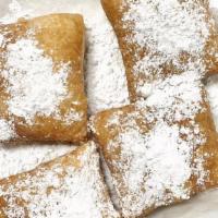 Beignets · Classic Deep Fried Pastry dough covered with powdered sugar. Order of 4