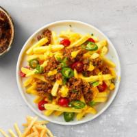 Cheesy Chili Fries · Idaho potato fries cooked until golden brown and garnished with salt, melted cheddar cheese,...