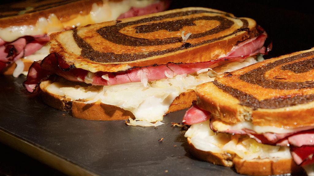 Grilled Reuben Sandwich · Tender pastrami, sauerkraut, swiss cheese, and 1000 island on toasted Jewish rye. Like to have with turkey just confirm.