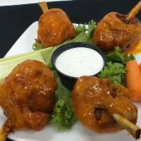 4 Bogeys Signature Wings · Bogeys French cut wings give you the most meat. We take large drums and shave down the end t...