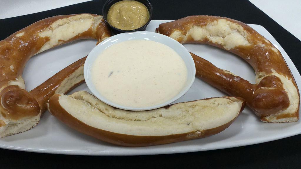 The Big Twist · Fresh from the oven big Bavarian pretzel served with Boulevard Wheat beer cheese and spicy mustard