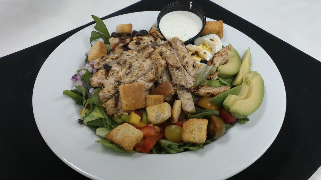 Cobb Salad · Mixed greens, tri-colored peppers, red onion, black olives, jack cheese, hardboiled egg, and avocado. Choice of grilled or fried chicken