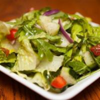 Dinner Salad · Fresh mixed greens, red onion, green peppers, sliced tomatoes, cucumbers, and croutons.
