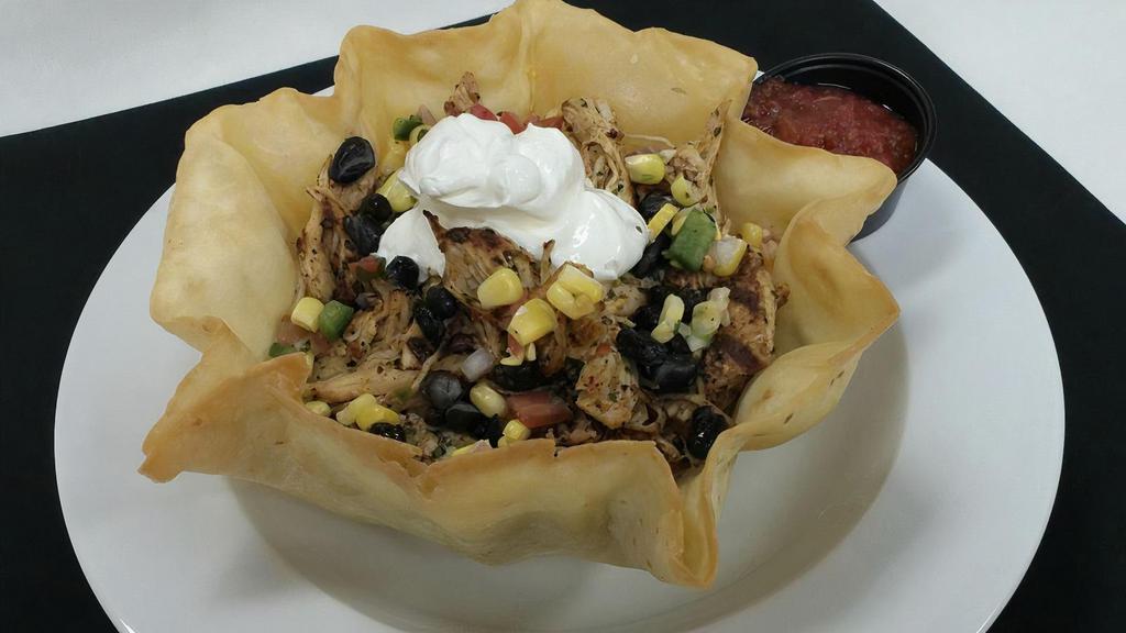 Southwest Salad · Shredded iceberg lettuce, corn pico, black beans, jack cheese, sour cream, and salsa served in a fried tortilla bowl.
Choice of chicken or beef