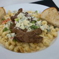 Steak And Gorgonzola Pasta · Grilled steak, sauteed spinach, sun dried tomatoes, gorgonzola crumbles, roasted red pepper ...