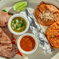 Carne Asada Platter · Juicy grilled carne asada with onions, red and green peppers, guacamole and pico de gallo se...