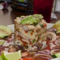 Seafood Tower · Specialty tower crafted with layers of scallops, shrimp, octopus, calamari and crab, tossed ...