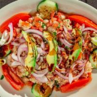 Ceviche Maviri · Tilapia, and shrimp with tomatoes, red onions, cucumbers, serrano peppers and cilantro.