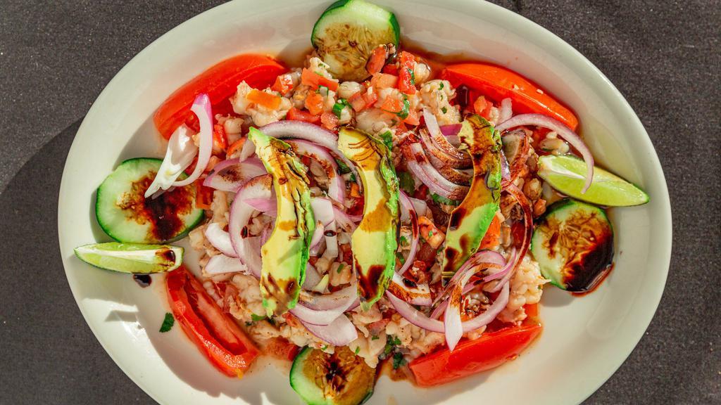 Ceviche Maviri · Tilapia, and shrimp with tomatoes, red onions, cucumbers, serrano peppers and cilantro.