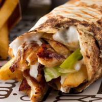 Chicken Shawarma · Organic chicken marinated in special spices, garlic sauce, pickles and fries.