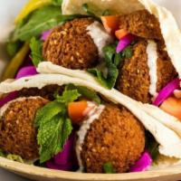 Falafel Wrap · Tahini sauce grind chickpeas with special spices and veggies.