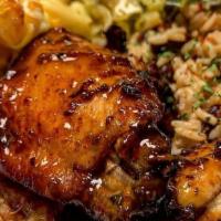 Caribbean Jerk Chicken Wing Dinner · Caribbean jerk chicken wings served with rice and peas, grilled cabbage and the best mac n c...