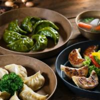 Chicken Dumplings (6 Pieces) · Steamed or pan-fried. Chopped chicken and mixed vegetables. Served with homemade soy sauce o...