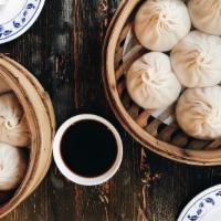 Juicy Steam Chicken Bun · Chicken soup dumplings, filled with a rich & Savory Broth (6 pcs)