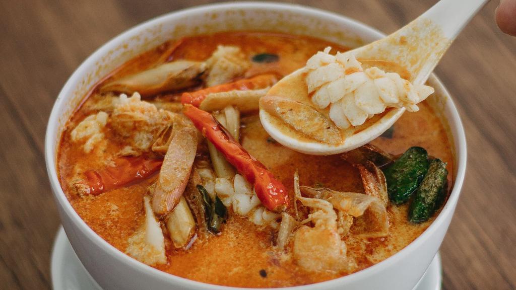 Tom Yum Chicken Soup · Spicy and sour soup with lemongrass, peppers, tomato, onion and mushroom.
