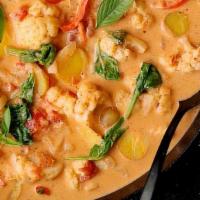 Malaysian Red Curry Style · Choice of meat with eggplant, bell peppers, fried tofu and snow peas in a spicy paste with c...
