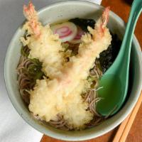 Udon · Thick wheat noodle in clear broth with choice of shrimp tempura, beef, vegetable, nabeyaki.