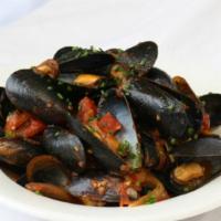 Zuppa Di Cozze · A hearty heaping bowl of cultivated mussels in white cam or marinara sauce.
