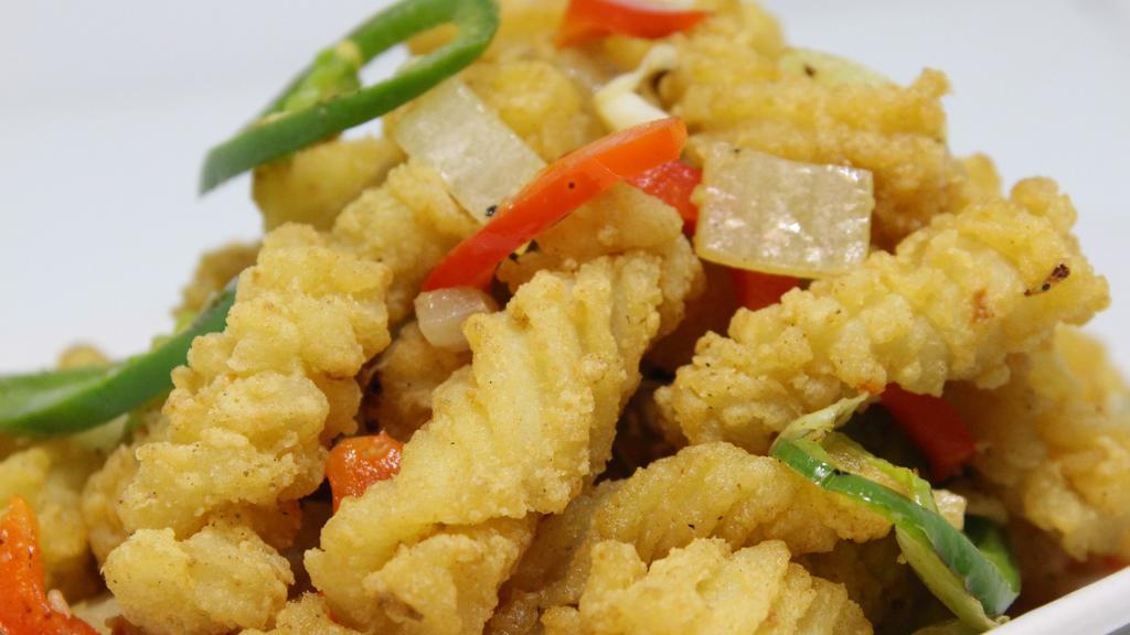 #23- Fried Calamari · Deep fried calamari stir-fried with salt & pepper tossed with bell peppers and jalapenos