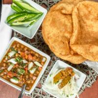 Chole Bhature · A pair of delicious fried bread made from a mixture of white and whole-wheat flour. Served w...