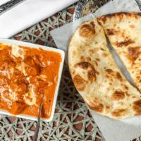 Butter Chicken · Shredded tandoori chicken meat cooked slow lying.