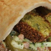 Falafel Sandwich · Hummus, pickles, and Jerusalem salad.