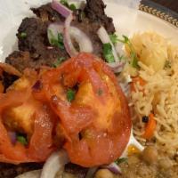 Beef Chappli Kabab · Served with nan, raita, salad, rice, and cholley.